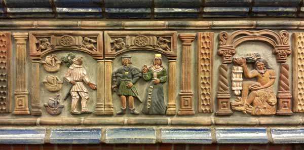 Three tiles from the frieze showing Columbus and Ferdinand and Isobella, and a Native American making arrowheads