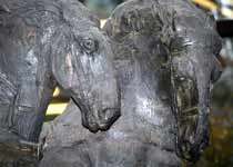 Close-up of the sculpture of a pair of horses focused on their heads and necks