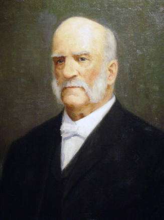 Shows Knapp with mutton chop whiskers, dark suit, white shirt and bow tie